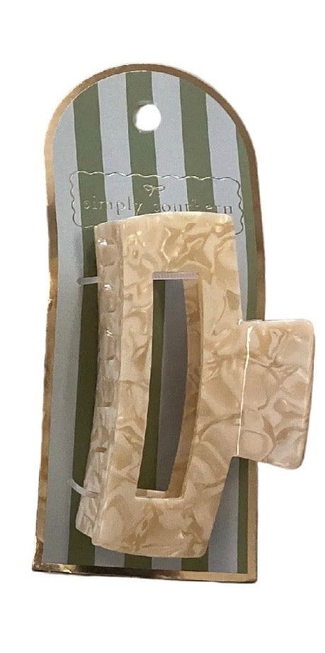 Beige marbled rectangle claw clip. Sizes available: not specified.