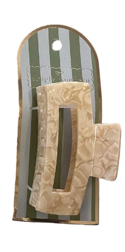 Beige marbled rectangle claw clip. Sizes available: not specified.