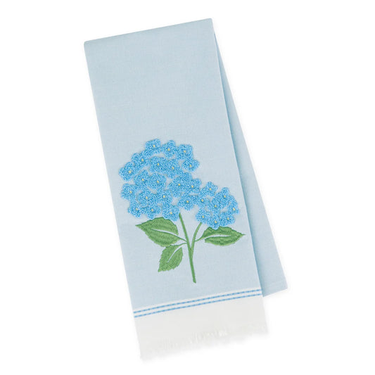 Light blue dishtowel with embroidered blue hydrangea, green leaves, white fringe. Available in 18"x28".