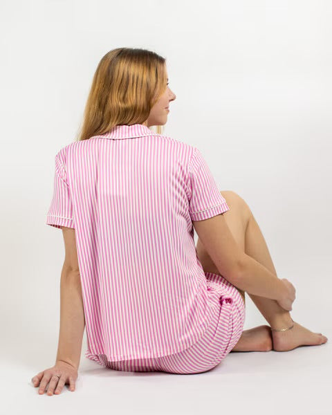 Pink and white pinstripe short-sleeve sleep shirt and shorts set with a collared top and elastic waistband.
