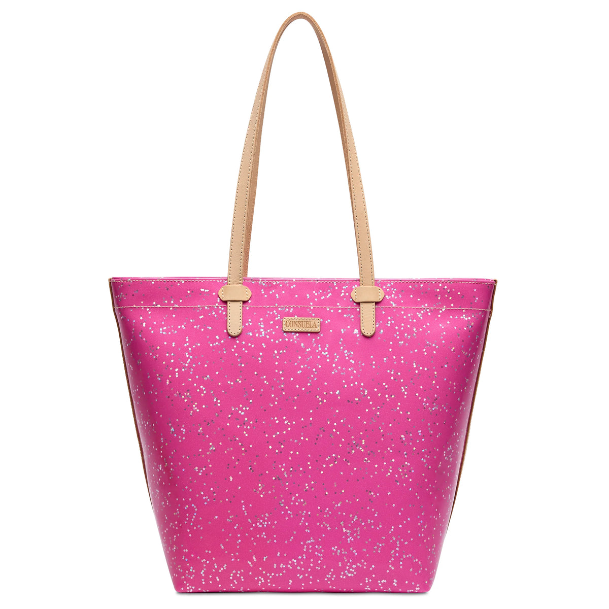The Daily Tote, Berry is a bright pink leather tote with white speckles, tan straps, a gold front label, and a spacious interior with zippered closure. Available in small, medium, and large sizes.