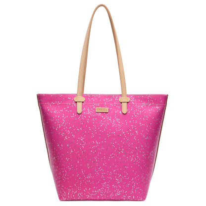 The Daily Tote, Berry is a bright pink leather tote with white speckles, tan straps, a gold front label, and a spacious interior with zippered closure. Available in small, medium, and large sizes.