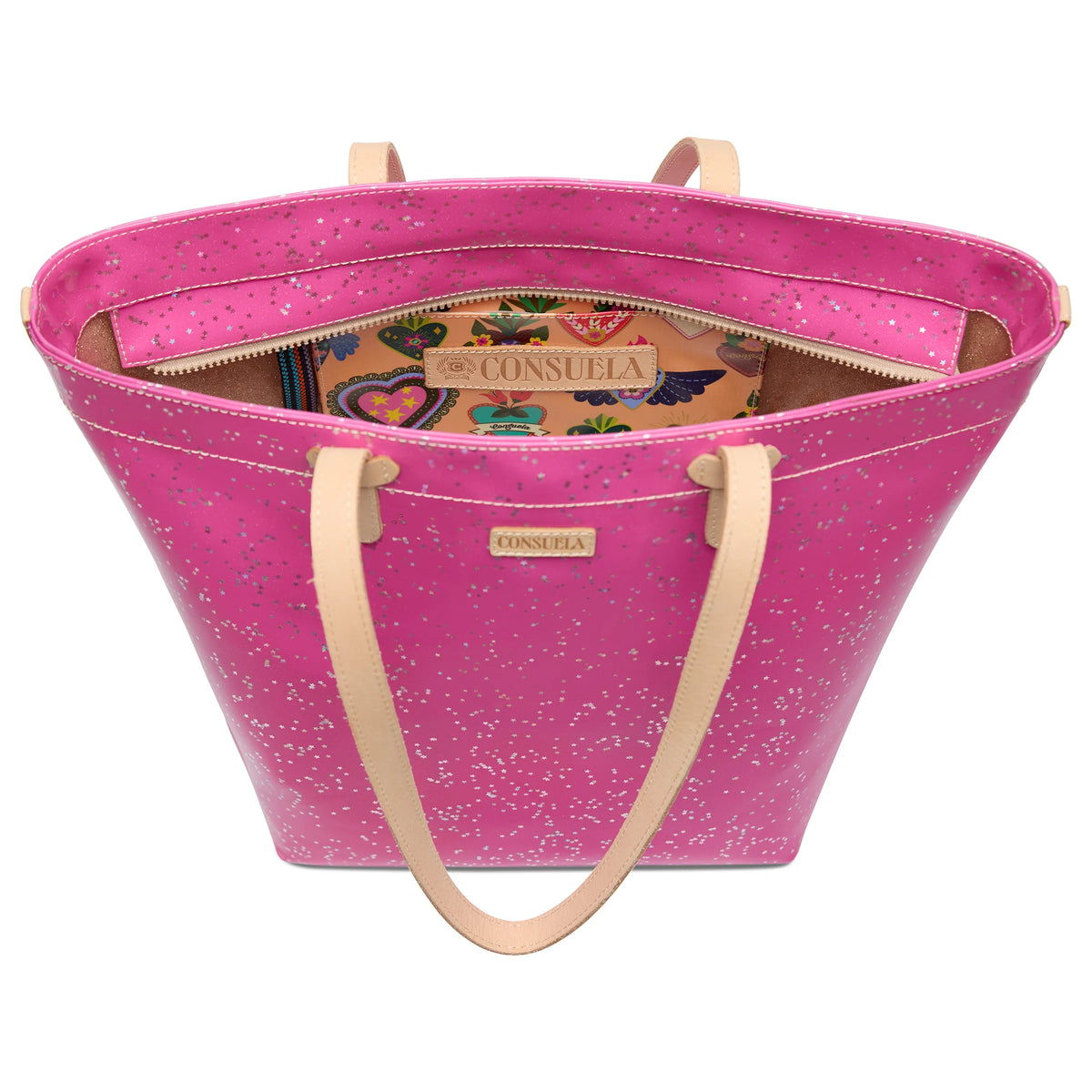 Pink leather Berry Daily Tote with beige handles, silver speckles, spacious interior, vibrant pattern, and “Consuela” label. Sizes available: small, medium, large.