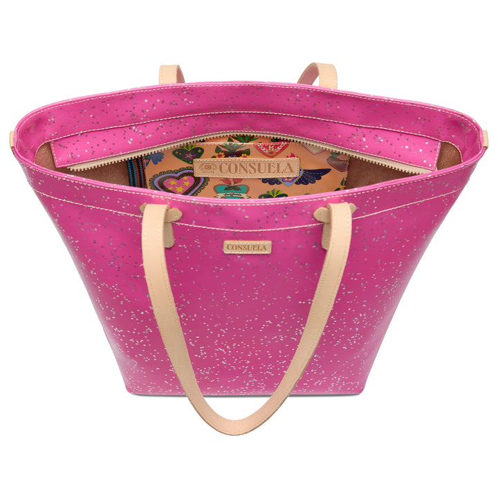 Pink leather Berry Daily Tote with beige handles, silver speckles, spacious interior, vibrant pattern, and “Consuela” label. Sizes available: small, medium, large.