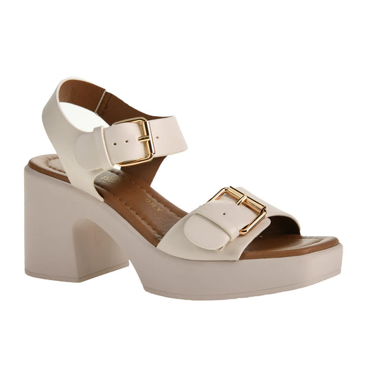 The Drew Platform Sandal in cream offers thick straps, adjustable gold buckles, a cushy block heel, and a textured sole. Available sizes: 6-10 including half sizes.