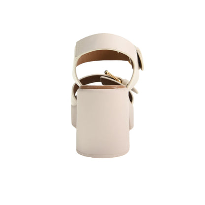 The Drew Platform Sandal in Cream features a cushy block heel and minimalist design with an adjustable buckle. Sizes available: 5-11.