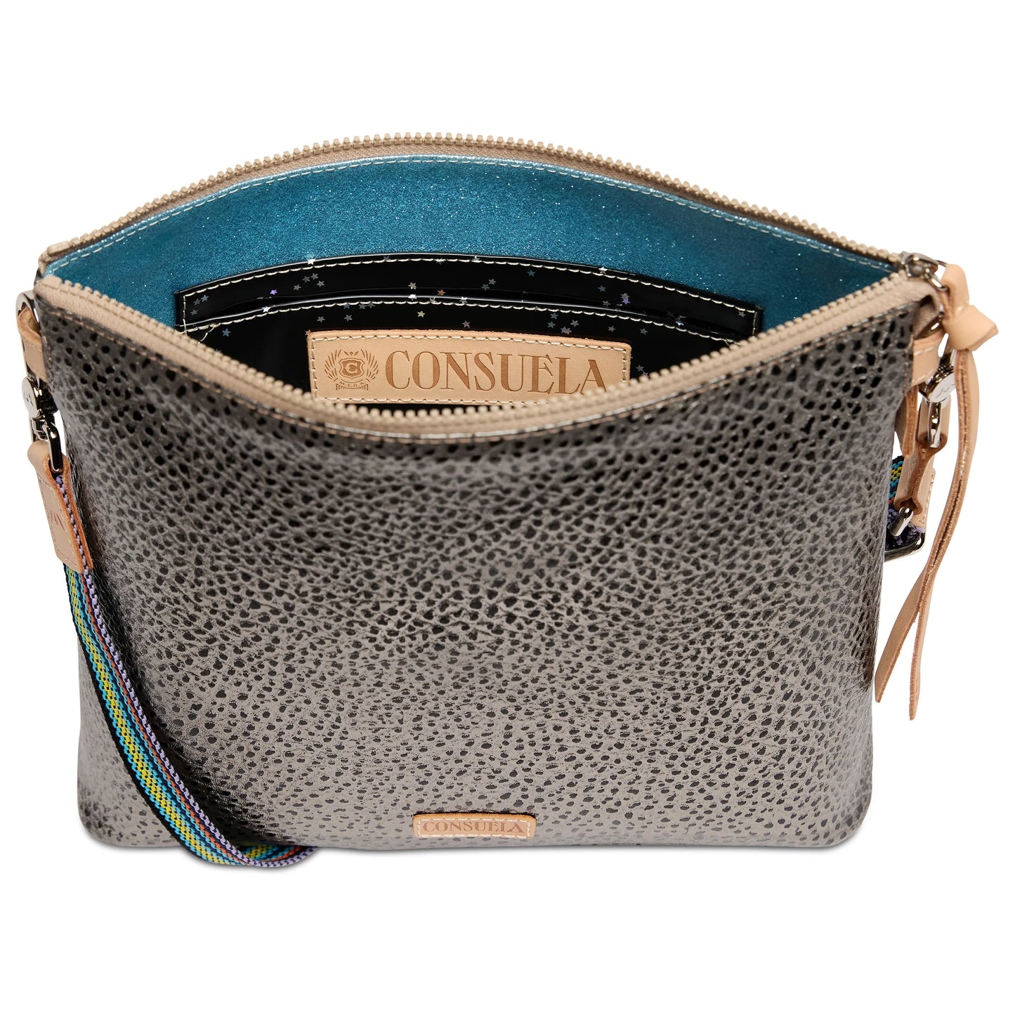 Textured gray leather crossbody bag with zip closure, teal lining, black pocket, vibrant adjustable strap, and interior Consuela label. Sizes available: not specified.