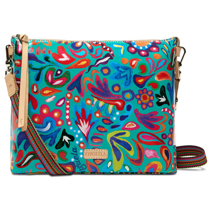Downtown Crossbody, Tasha—a colorful crossbody bag in ConsuelaCloth® with blue, red, yellow, and green abstract floral print. Features adjustable striped strap and tan leather accents. Available in one size.