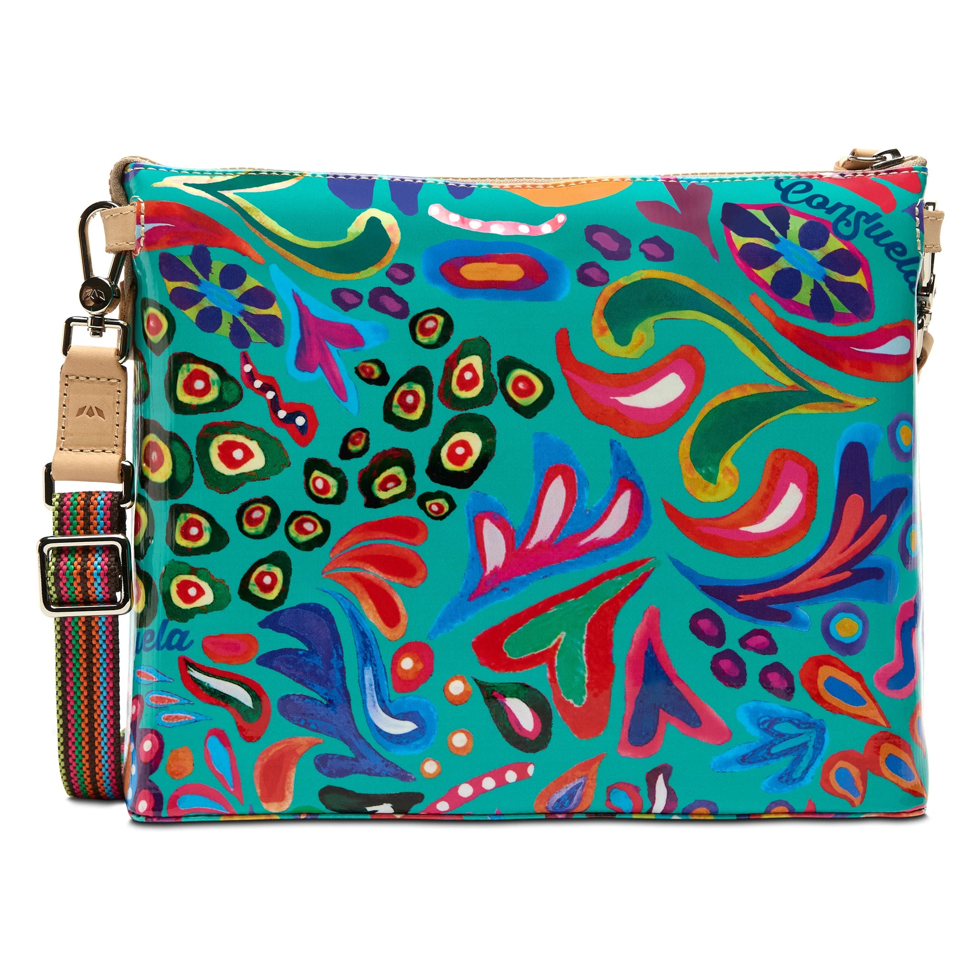 The Downtown Crossbody, Tasha is a durable ConsuelaCloth® bag with a colorful abstract floral pattern in red, blue, green, and yellow. Features an adjustable striped strap. Available in one size.