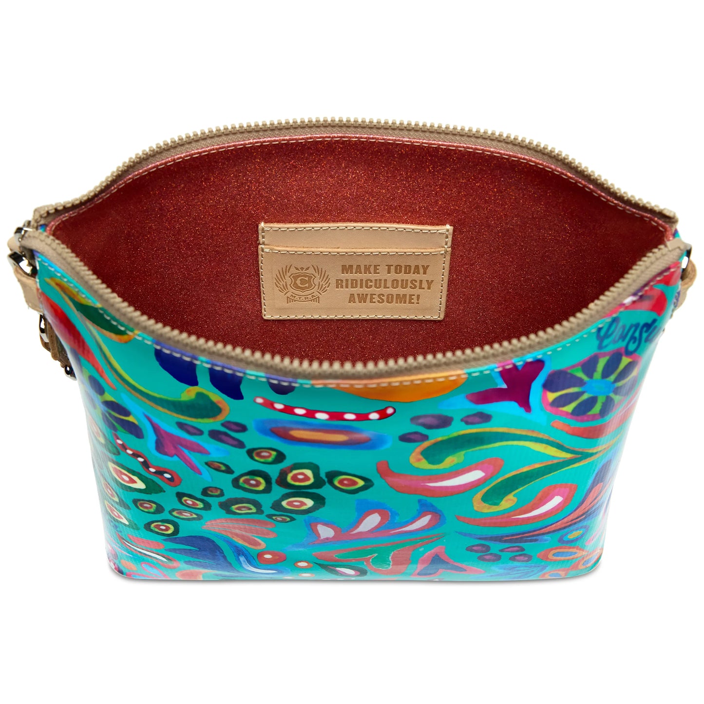 Colorful patterned ConsuelaCloth Downtown Crossbody, Tasha purse with a zippered opening, brown interior, inspirational label inside, and adjustable strap. Available in one size.