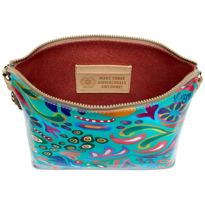 Colorful patterned ConsuelaCloth Downtown Crossbody, Tasha purse with a zippered opening, brown interior, inspirational label inside, and adjustable strap. Available in one size.