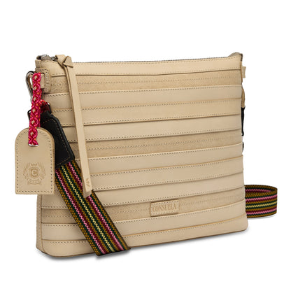 Beige crossbody bag in Diego leather with horizontal stitching, adjustable multicolored striped strap, cream luggage tag, and red keychain. Available sizes: Small, Medium.