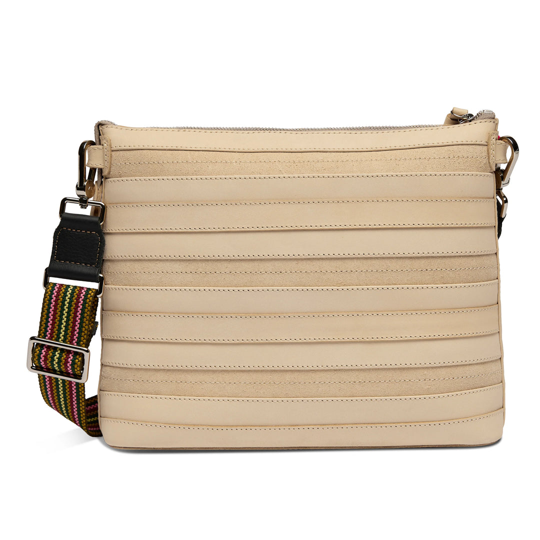 Beige Diego leather crossbody bag with horizontal stitched lines, wide adjustable striped strap, metal hardware, and zippered top closure. Available in multiple sizes.