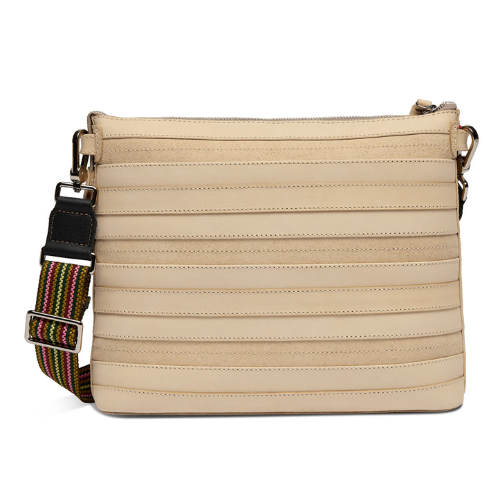 Beige Diego leather crossbody bag with horizontal stitched lines, wide adjustable striped strap, metal hardware, and zippered top closure. Available in multiple sizes.
