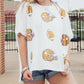 Loose white Sequin Football Game Day Shirt with sequined football helmet designs. Sizes: Small, Medium, Large, Extra Large.