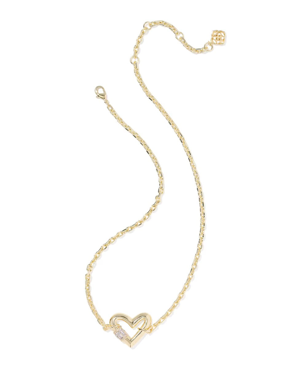 Gold chain necklace with heart-shaped white crystal pendant. Available in 16", 18", and 20" lengths.
