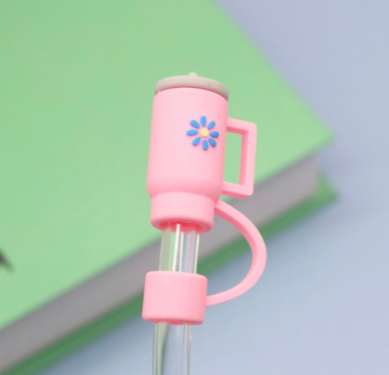 This product is a pink mechanical pencil adorned with a charming flower design. It comes equipped with a straw cover cap for protection. Also, it has an added feature, which is its ability to clip onto notebooks or pockets for convenient storage. This item does not include the green notebook in the picture. The available sizes of this mechanical pencil will accommodate all standard lead sizes.