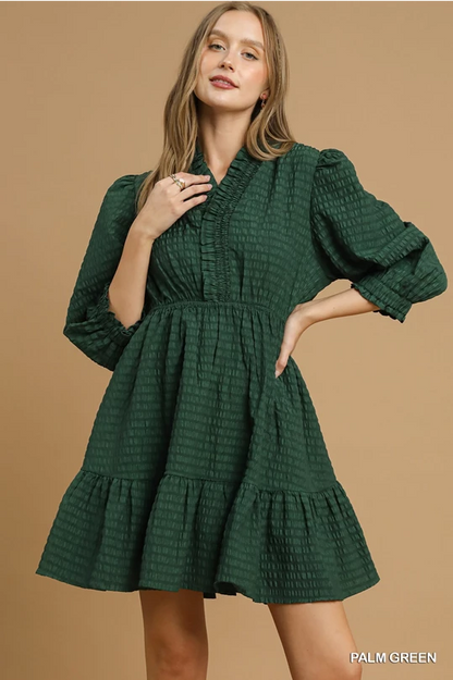 Palm Green Babydoll Dress: textured, ruffled mini dress with long sleeves. Available in sizes XS-XL.