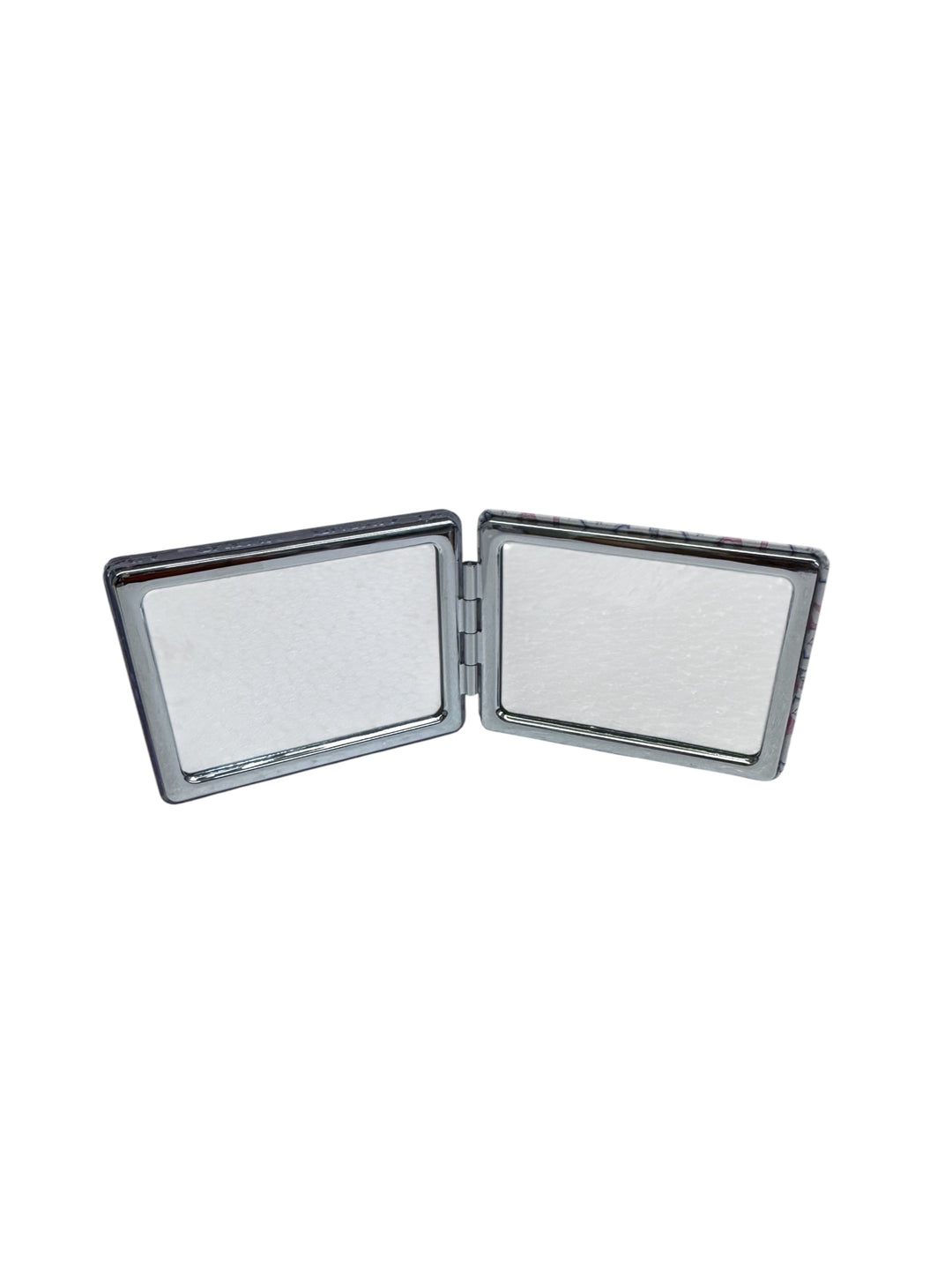 Small, rectangular silver compact mirror with two empty panels joined by a hinge. Available sizes: not specified.