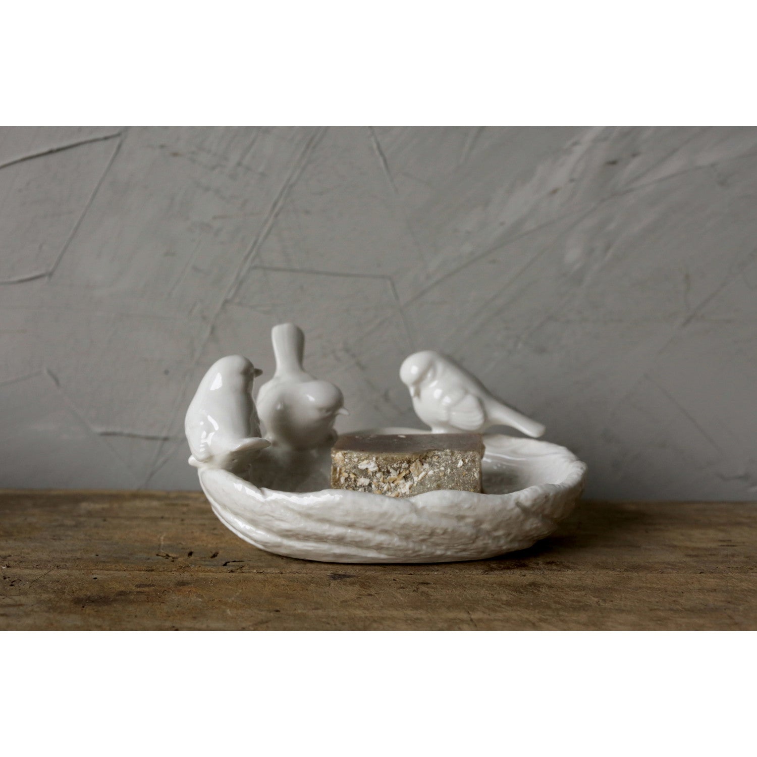 Ceramic leaf dish with three perched birds, ideal for treats. Available sizes: small, medium, large.