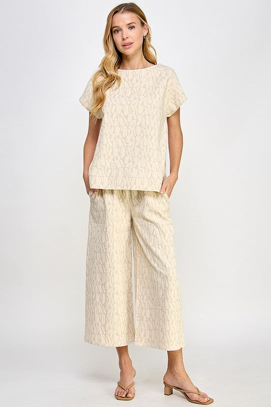 Beige Jacquard Linen Lounge Set with short-sleeve top and wide-leg pants, subtle texture. Available in sizes XS–XL.