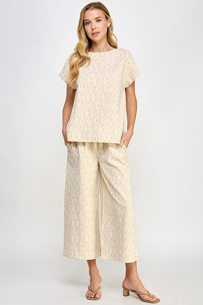 Beige Jacquard Linen Lounge Set with short-sleeve top and wide-leg pants, subtle texture. Available in sizes XS–XL.