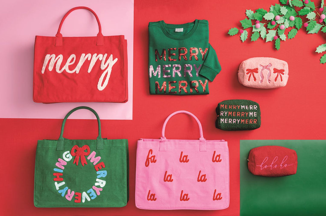 Holiday Boucle Tote, a red canvas bag featuring “merry” embroidered in white bouclé yarn.
