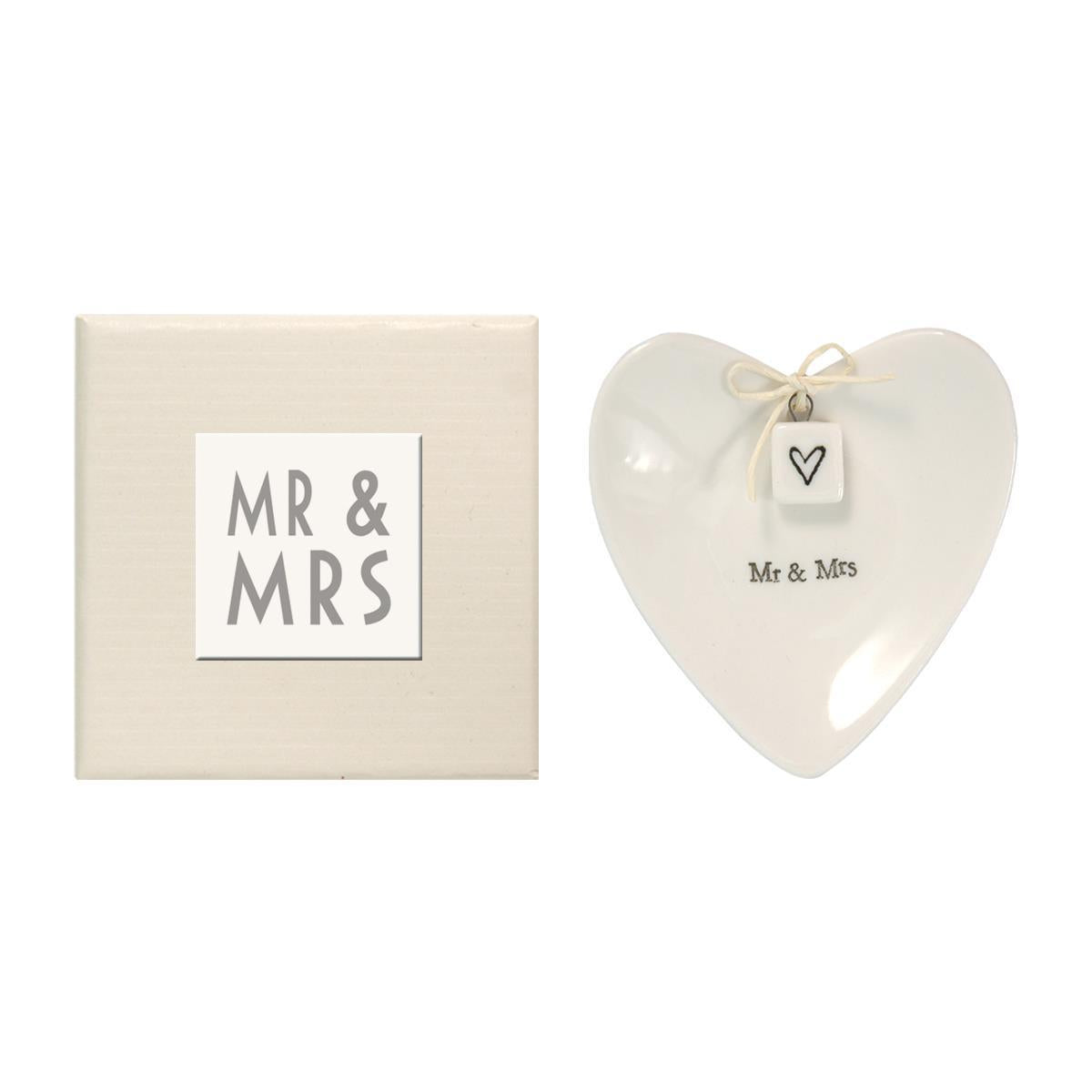 Heart-shaped "Mr & Mrs" ring dish with black heart charm and string, in cream gift box. Size: 4x4 inches.