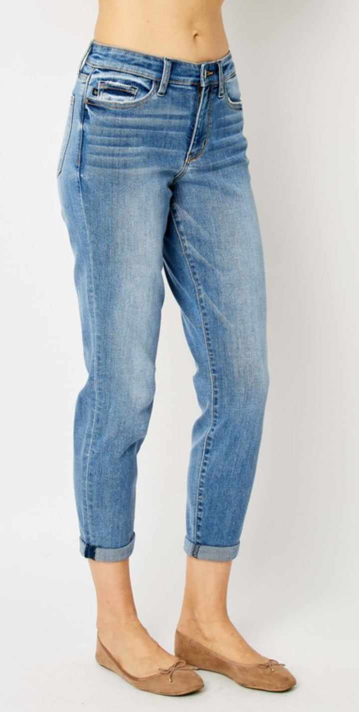 Judy Blue Mid Rise Slim Fit Cuffed Jeans in light blue. Available in sizes 24–32, 14W–24W.