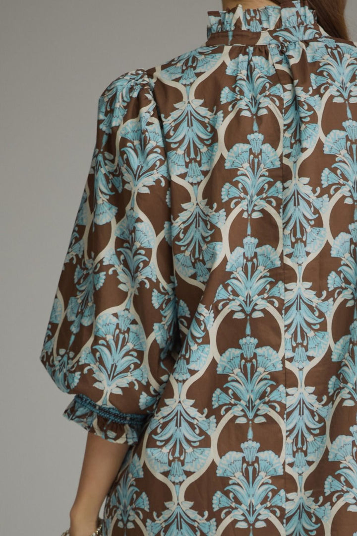 Lena Ruffle Midi Dress with ruffled high neck, long puff sleeves, and brown and light blue damask floral print. Available in multiple sizes.