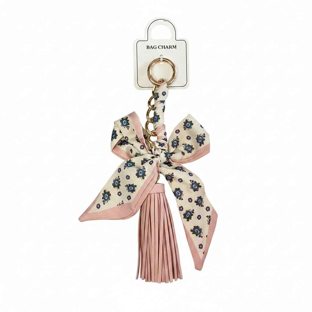 Pink and cream bow with blue flowers, gold keyring, gold chain, and pink tassel. Available in small and medium sizes.