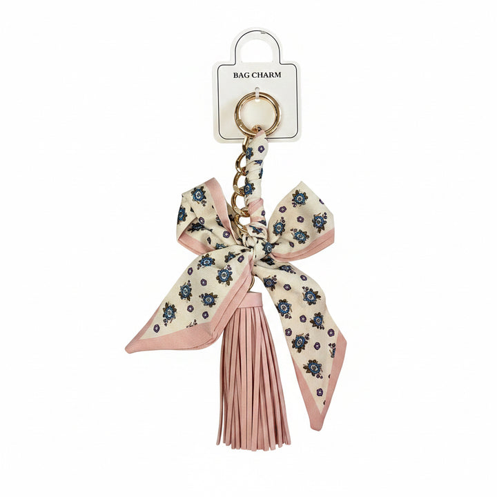 Pink and cream bow with blue flowers, gold keyring, gold chain, and pink tassel. Available in small and medium sizes.