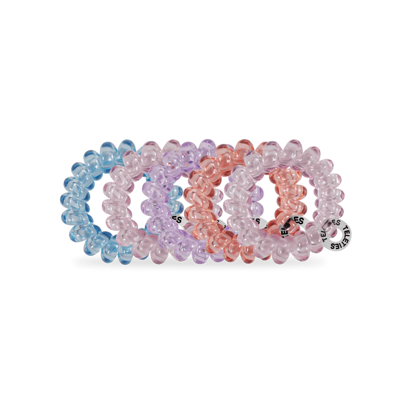 Four TELETIES Hair Ties in translucent blue, lavender, pink, and peach. Available in small and large sizes.