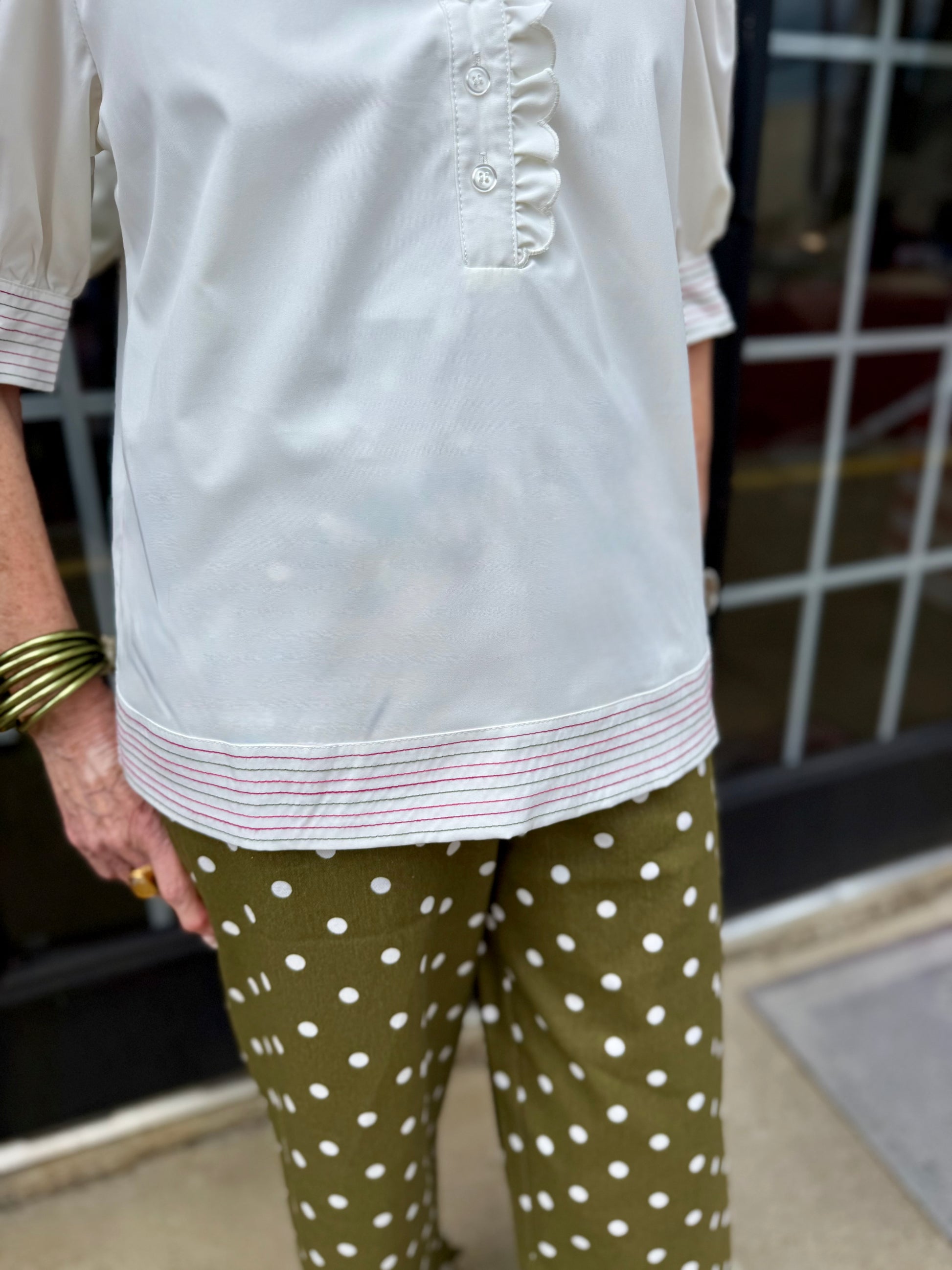 Emmie Ivory Top: white blouse with pink striped hem and delicate ruffle neckline. Available in sizes XS-XL.