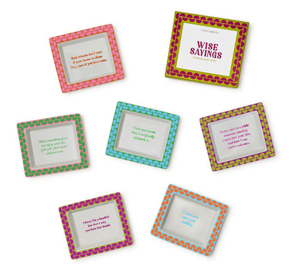 Set of seven colorful porcelain desk trays with decorative borders, each featuring a unique quote. Available in assorted sizes.