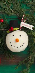 Felted wool Snowball Ornament with black top hat and “oh so merry” tag.