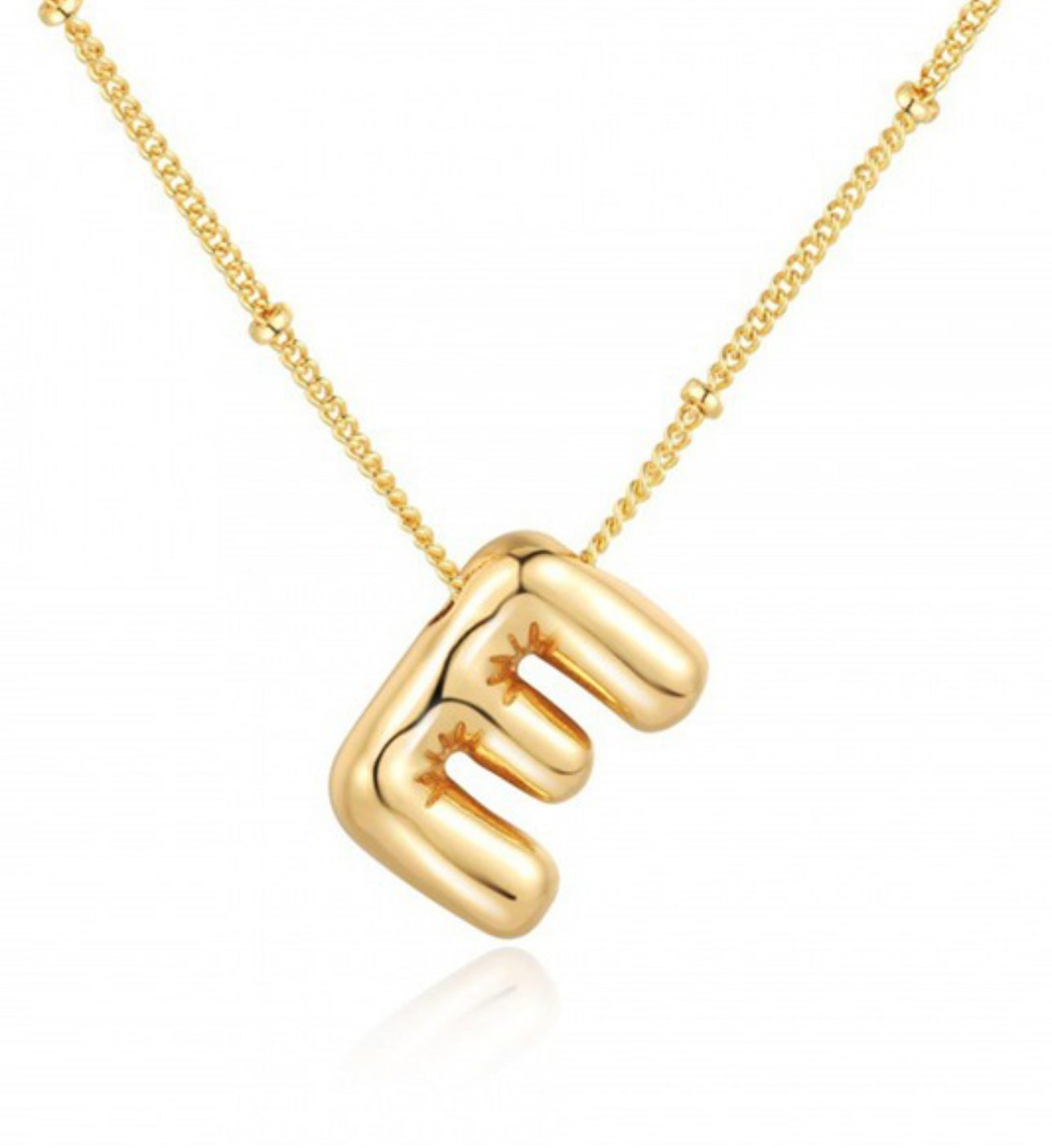 This Personalized Bubble Balloon Initial Necklace features a unique pendant designed like a clenched fist. The pendant hangs elegantly from a bead chain necklace, offering an eye-catching look. With the option to add any initial on the balloon, it becomes an even more personalized accessory. The necklace is created with meticulous attention to detail and exudes subtle sophistication and elegance - perfect for everyday wear or special occasions. Available in standard sizes suitable for everyone's needs.