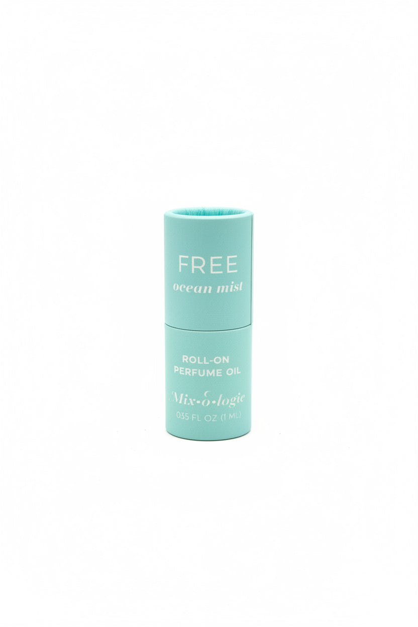 Turquoise cylinder labeled "FREE ocean mist ROLL-ON PERFUME OIL," Keychain Mini Rollerball Perfume, available in mini size.