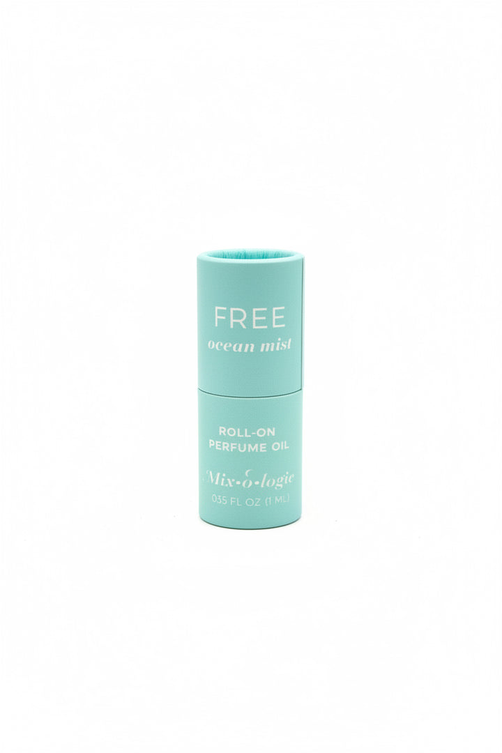 Turquoise cylinder labeled "FREE ocean mist ROLL-ON PERFUME OIL," Keychain Mini Rollerball Perfume, available in mini size.