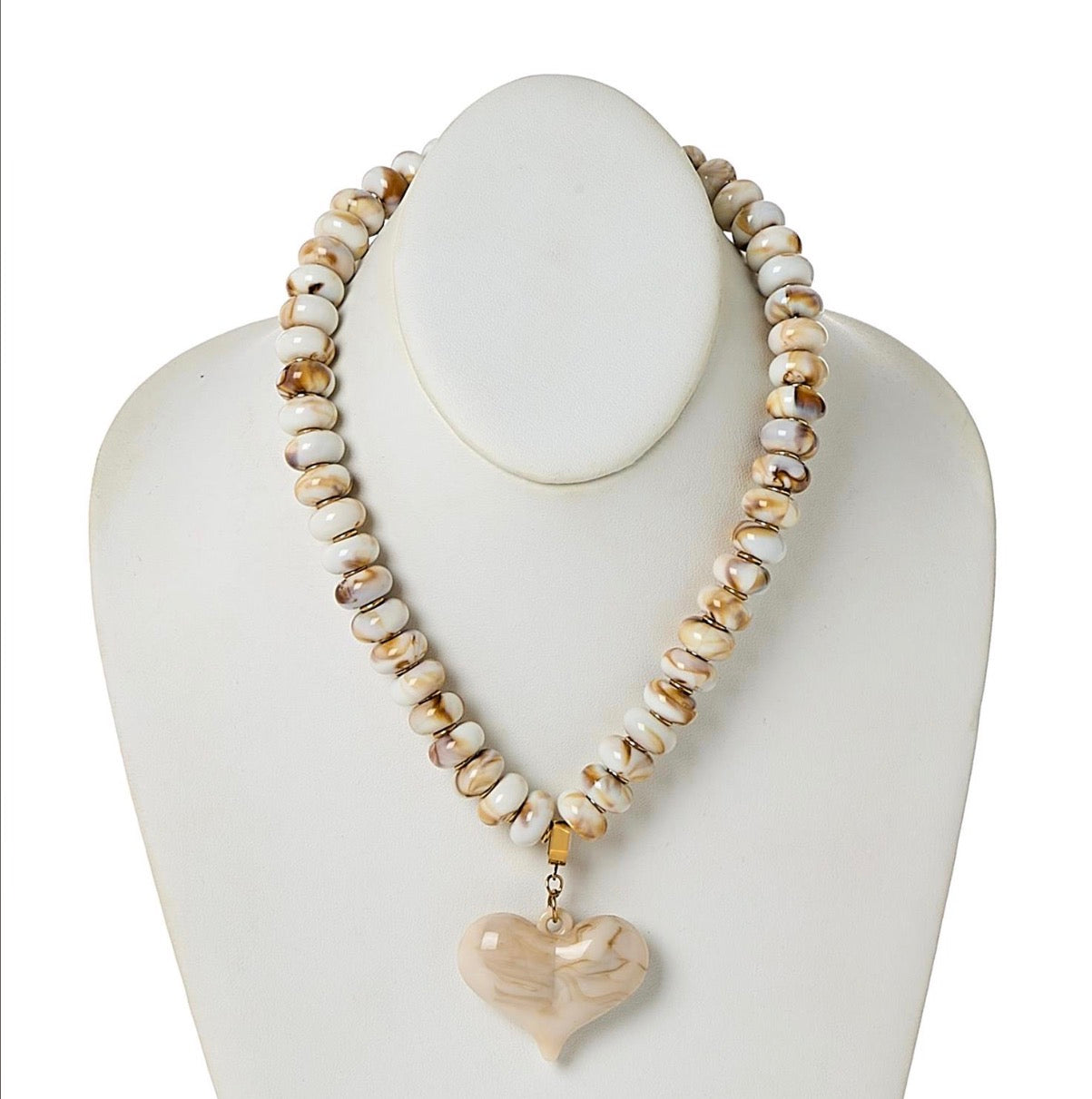 Happy Heart Beaded Necklace with round cream and beige beads and a marbled beige heart-shaped pendant; available in 16, 18, and 20 inch lengths.