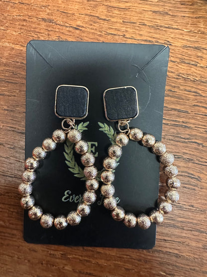 Tear Drop Satin Earrings with black square studs, large teardrop loops, metallic silver beads; available in small and large sizes.