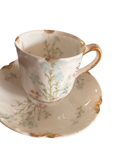 Antique porcelain demitasse cup and saucer with blue, pink florals, gold accents. Sizes available: demitasse.