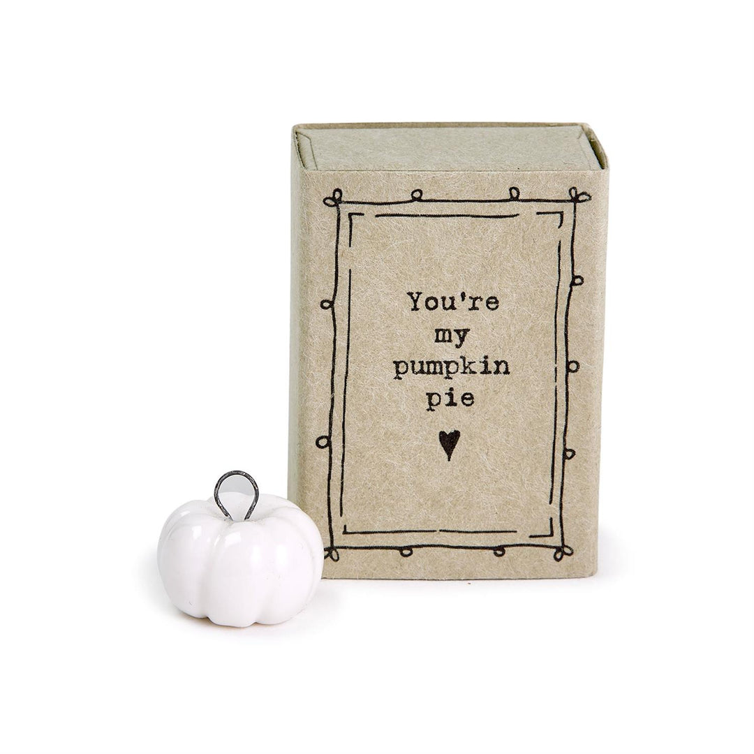 Small white pumpkin figurine in matchbox with "You&