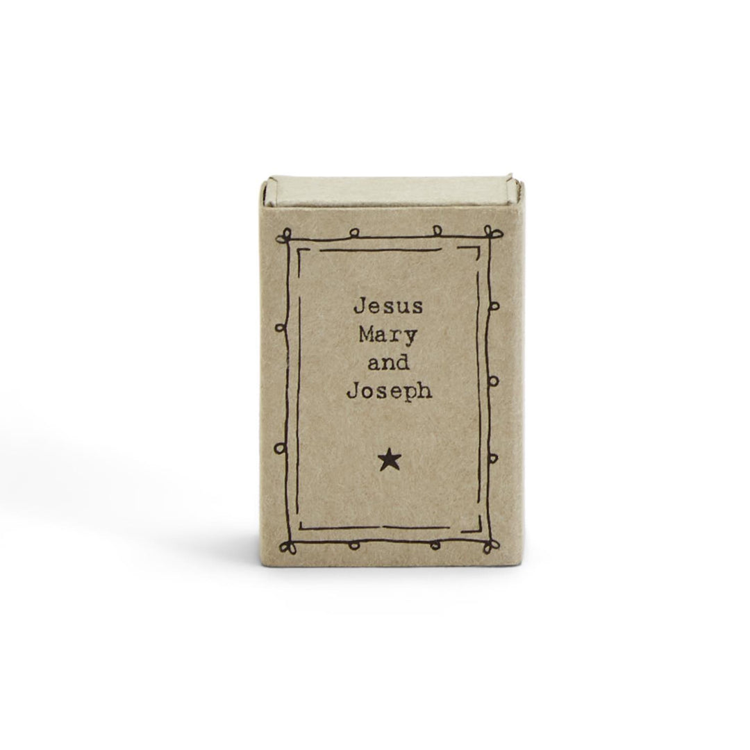 Small East of India Christmas matchbox with a hand-drawn border, “Jesus Mary and Joseph” text, and a star.