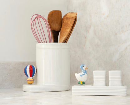 White kitchen utensil holder with wooden spoons and a red whisk, available in small (5″), medium (7″), and large (9″) sizes.