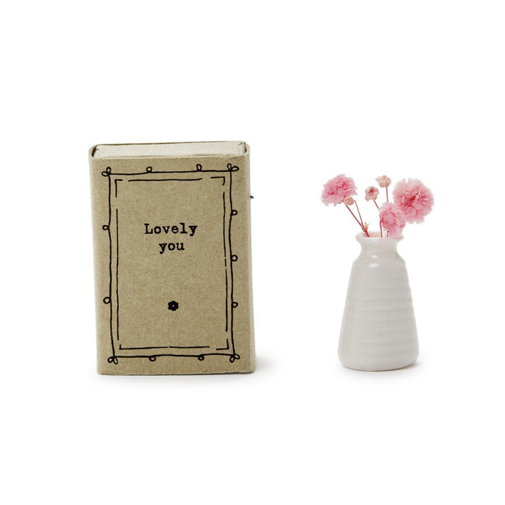 Lovely You": A small, charming book. "Lovely Matchbox Vase": Features delicate dried flowers.