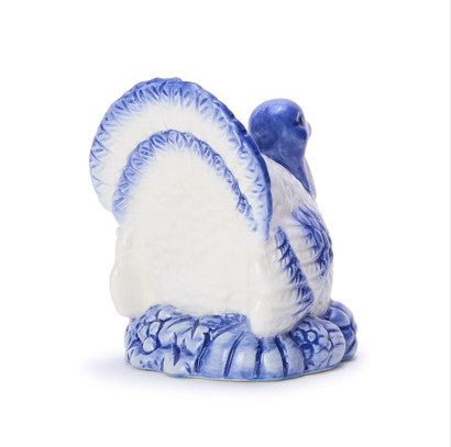 Hand-painted blue and white ceramic turkey candleholder with intricate feather detailing; available in multiple sizes.