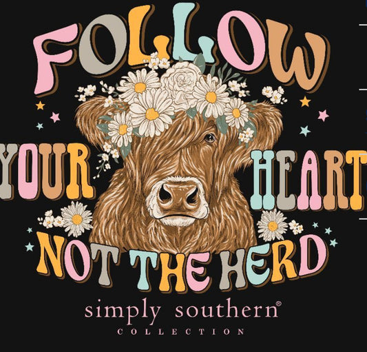 Illustration of a brown cow surrounded by daisies with the phrases "FOLLOW YOUR HEART NOT THE HERD" in stylized fonts, from Herd Comet Tshirt collection.