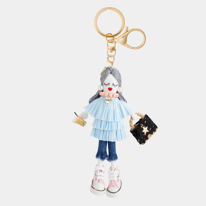 Darling Divas Bag Charm + Key Fob: doll with blue ruffled dress, jeans, pink sneakers. Available in small and medium.