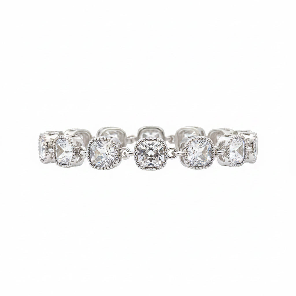The Jason Silver Clear Crystal Tennis Bracelet features cushion-cut clear crystals in detailed linked bezels. Available in sizes 6.5", 7", and 7.5".